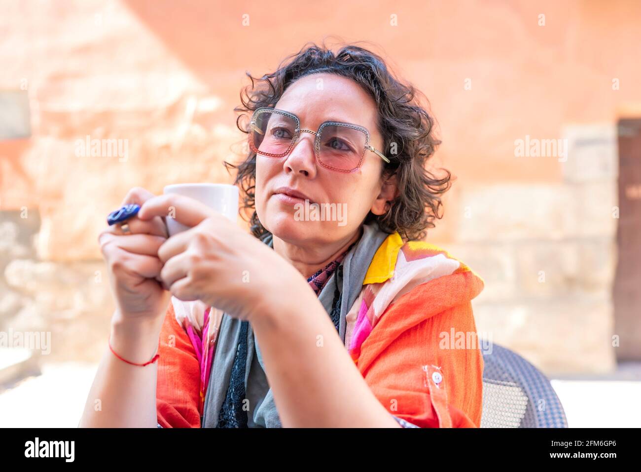 portrait of middle-aged woman having a cup of coffee Stock Photo