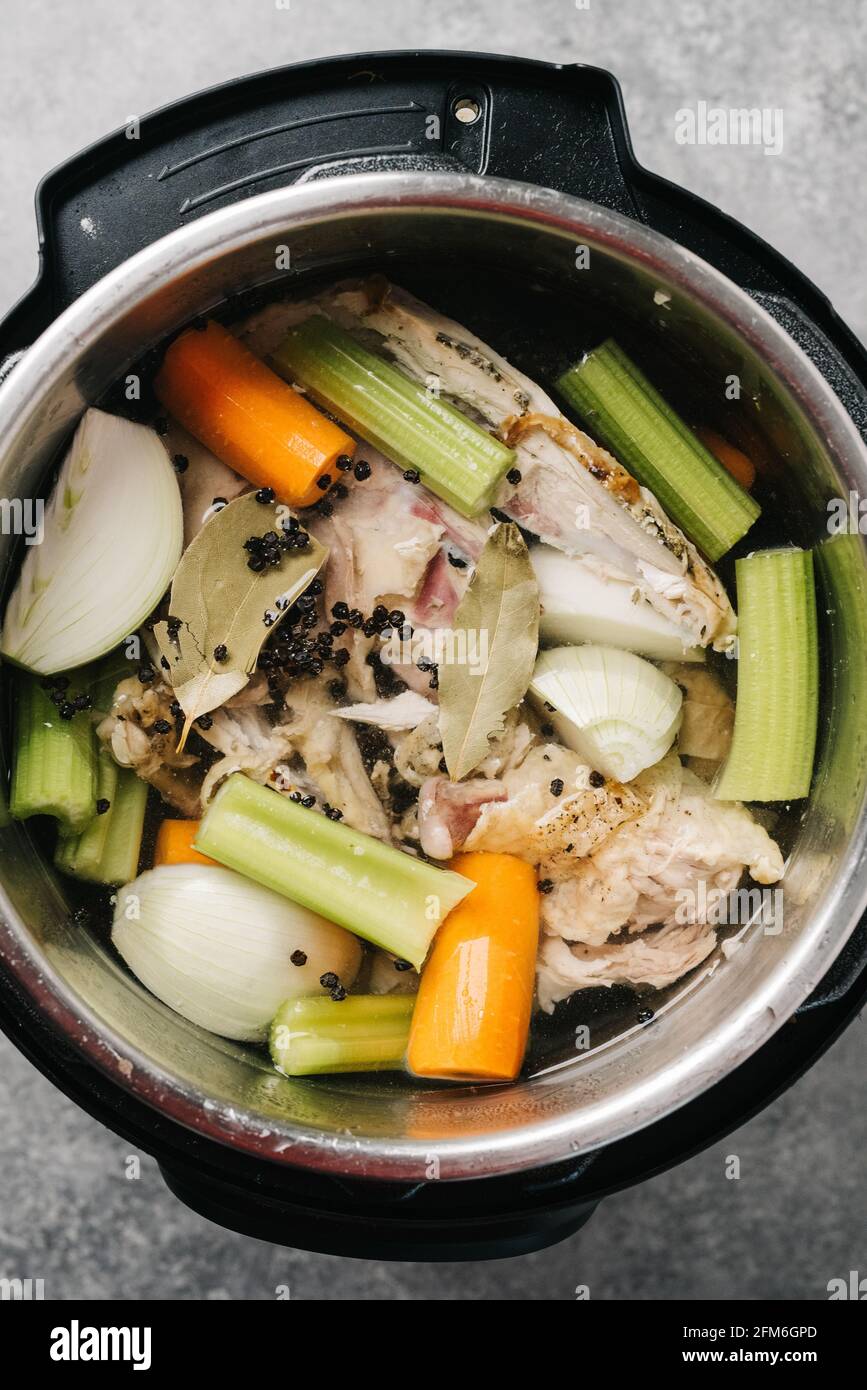 Overhead photo of ingredients used to make chicken stock in a pot Stock