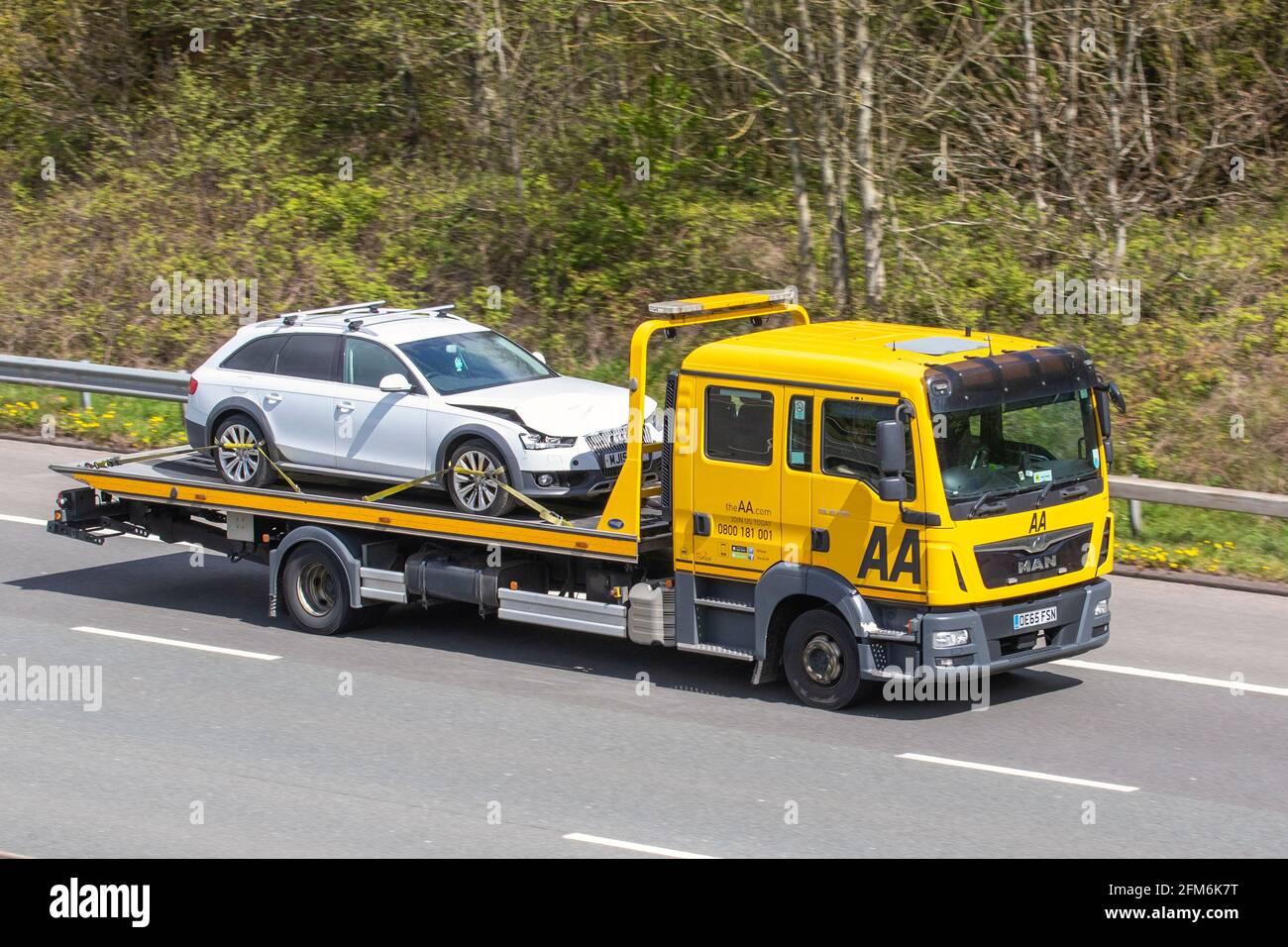 Crashed 2015 Audi Allroad Tdi Quattro being transported by AA 24hr roadside accident rescure vehicle; Stock Photo