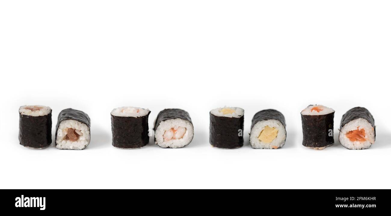Four maki rolls in a row isolated on white background. Fresh hosomaki