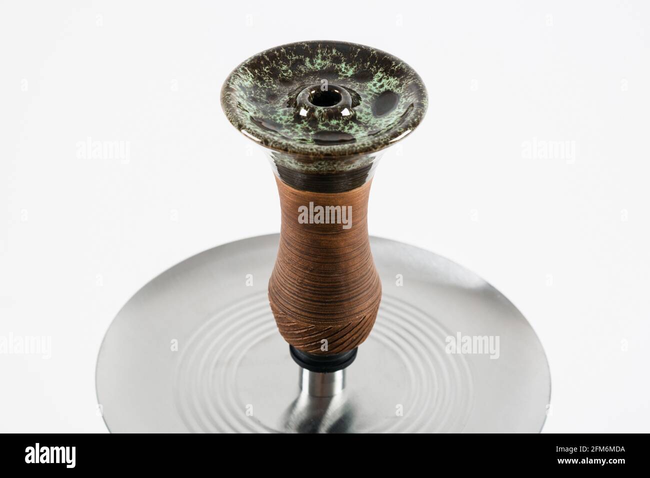 Stylish ceramic hookah bowl on a white background. Stock Photo