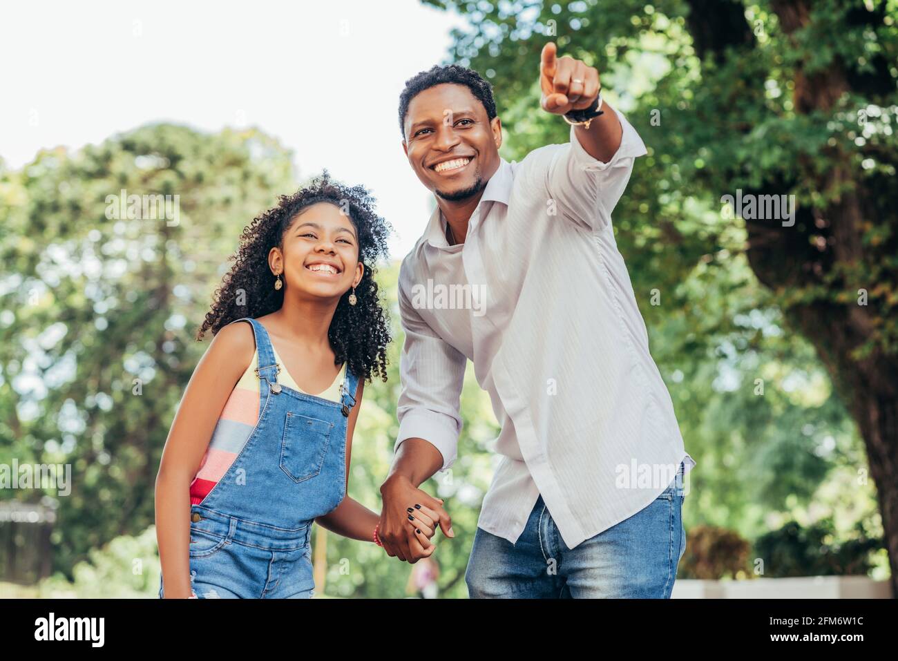 Father and daughter enjoying a walk together outdoors Stock Photo - Alamy