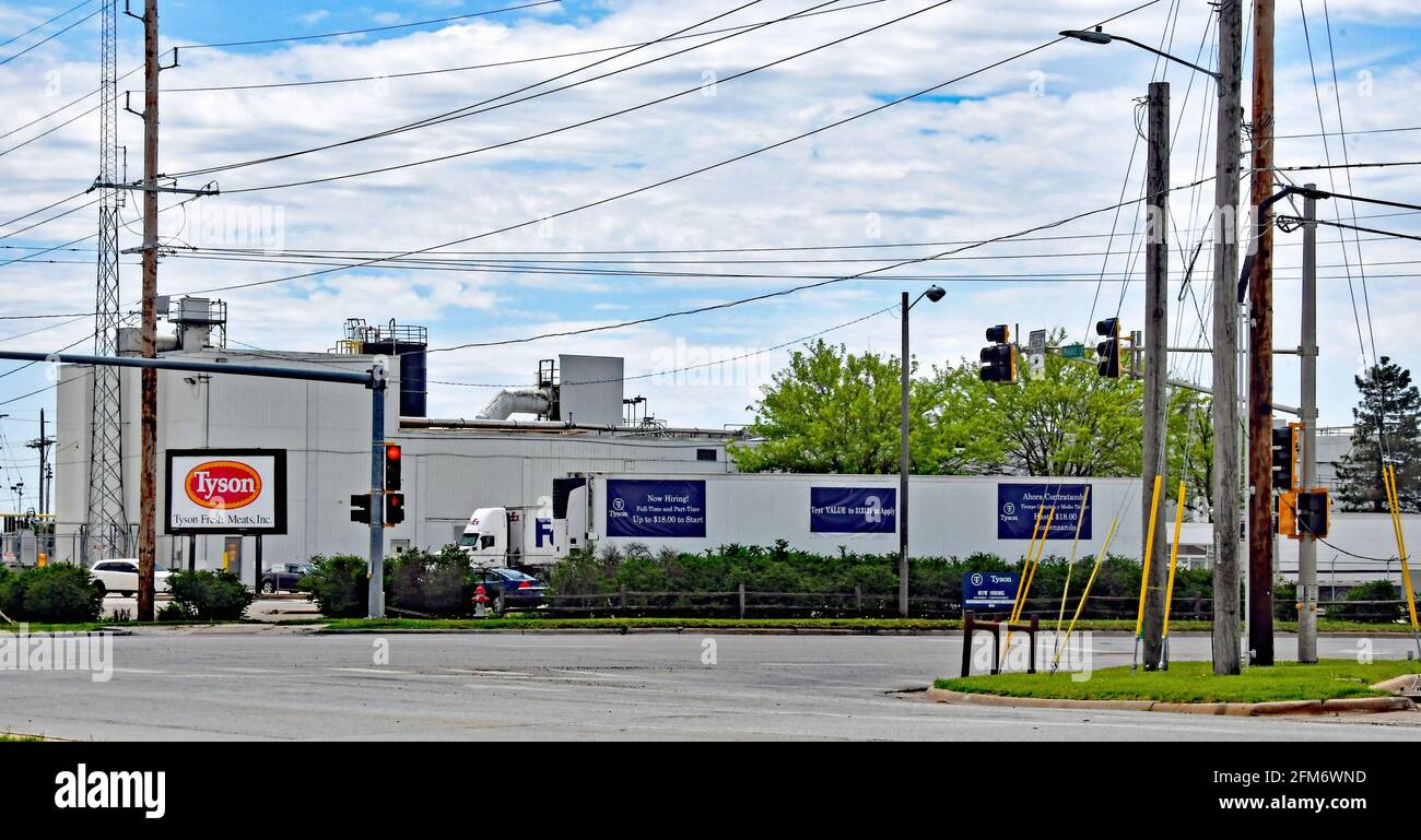 Now hiring signs in both English and Spanish are posted around the