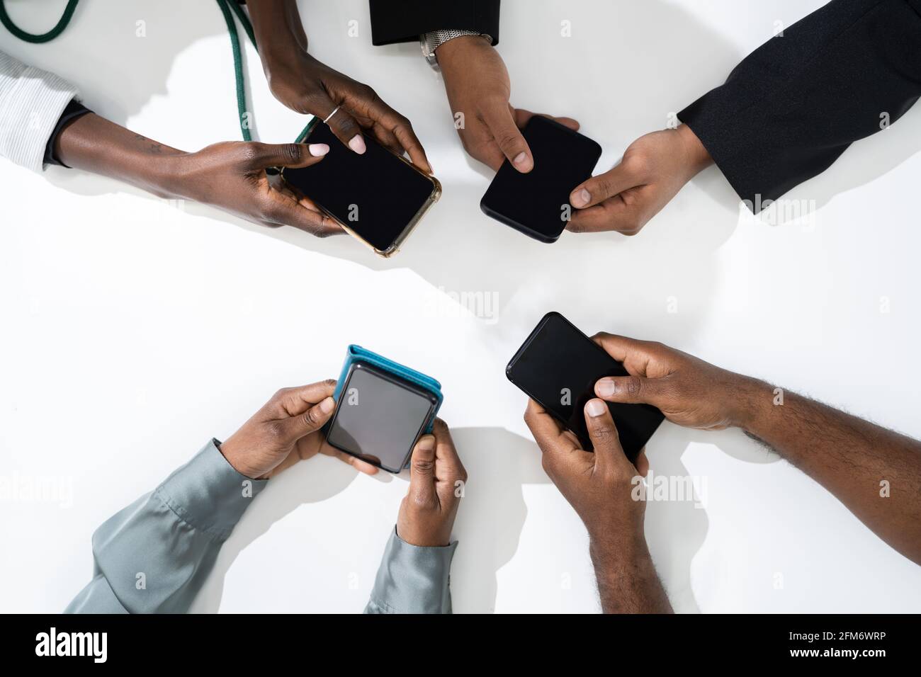 African American Family Couple Using Mobile Phone Stock Photo