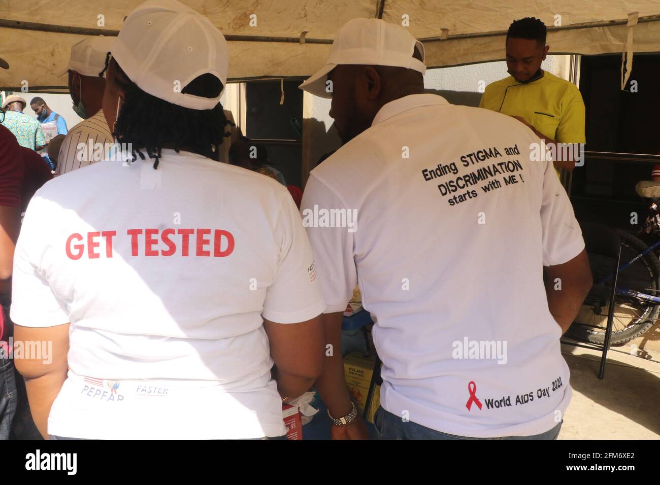 Health workers at work on HIV/AIDS testing on International Workers Day. International Workers Day is celebrated on every May 1, across the World, and it is observed to spread awareness among people, regarding the rights of workers and to mark their achievements. Lagos, Nigeria. Stock Photo