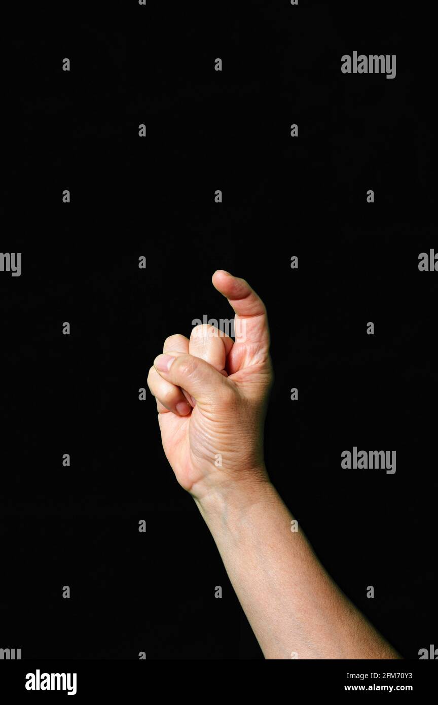 Hand making and showing Letter X International sign language dark