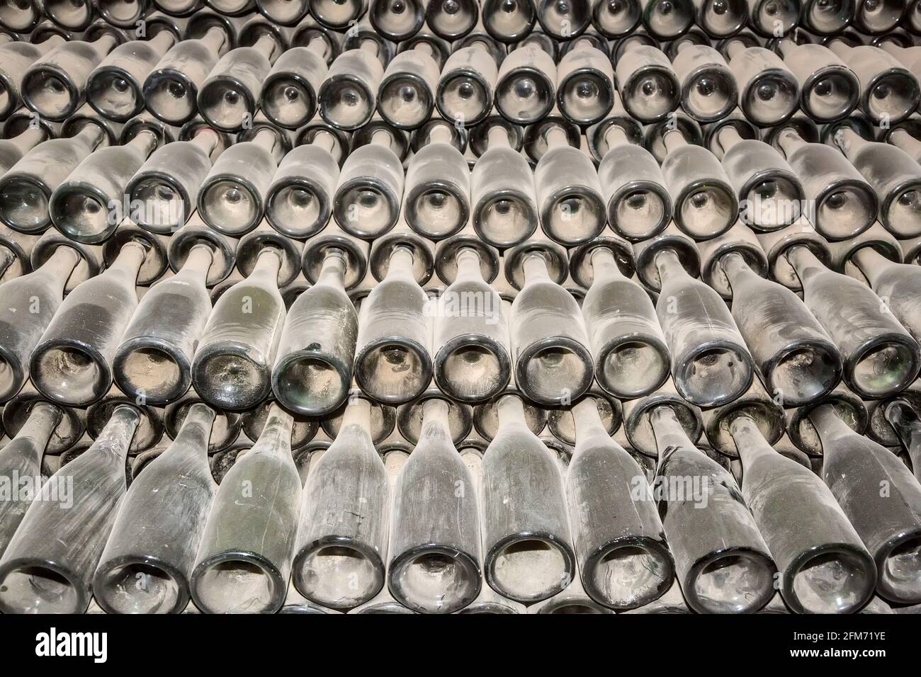 Dusty empty wine bottles in storage, Bodegas el Grifo wine museum, La Geria, Lanzarote, Canary Islands, Spain Stock Photo