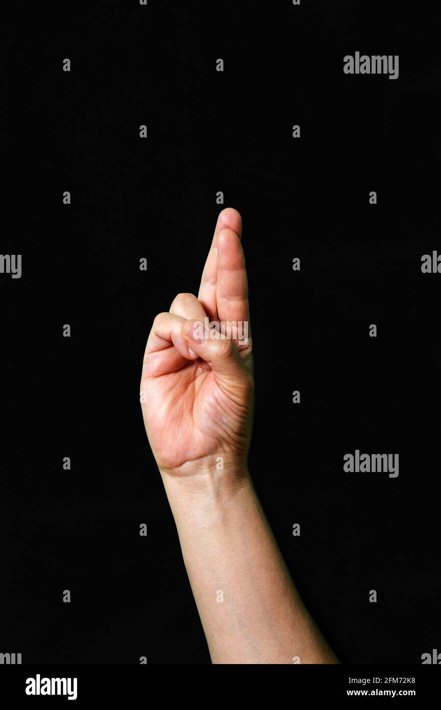 Hand making and showing Letter R International sign language dark ...