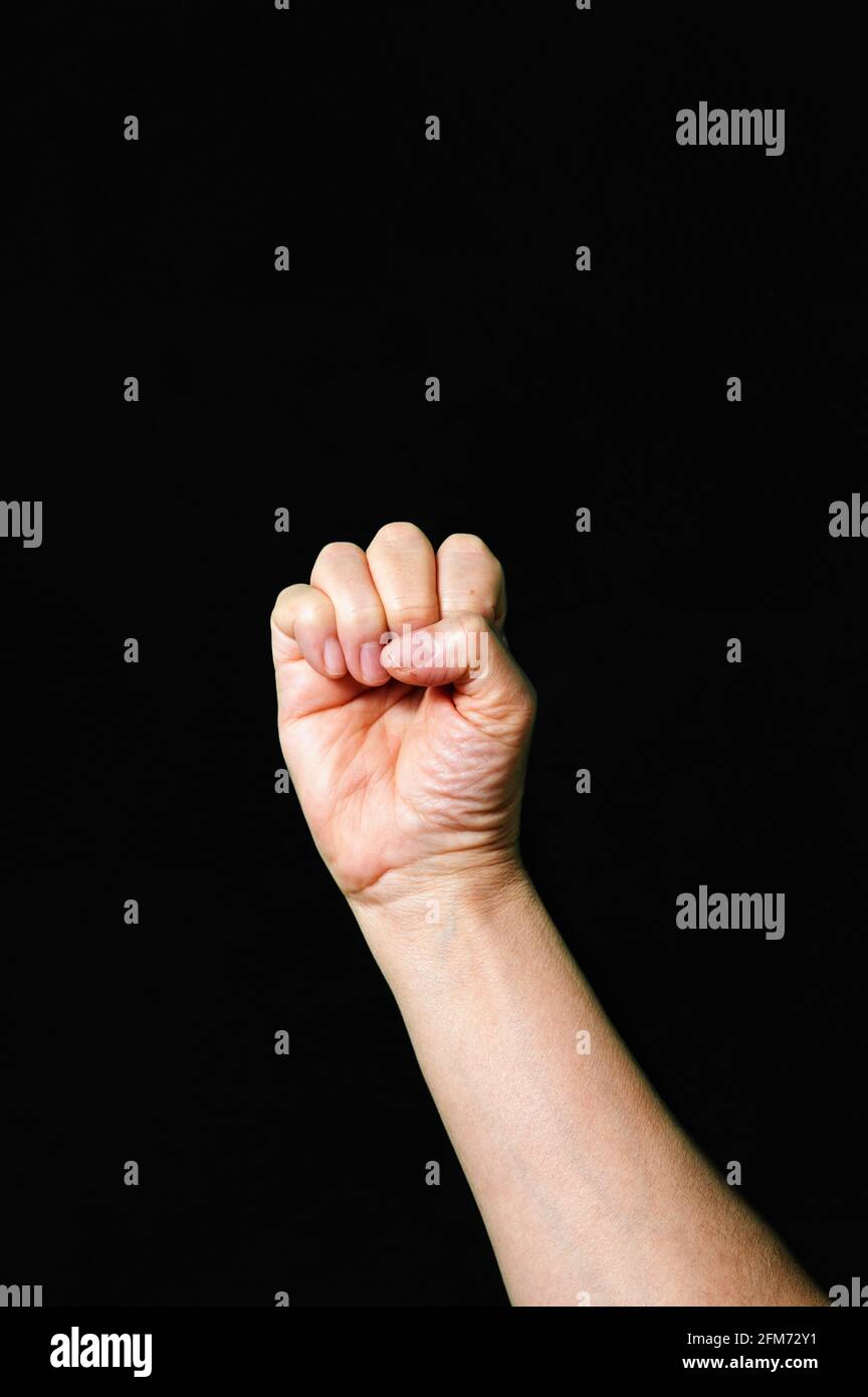 Hand making and showing Letter E International sign language dark