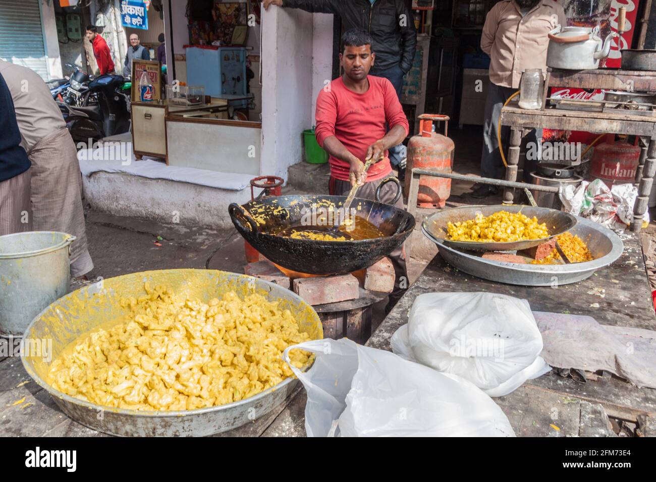 AMRITSAR, INDIA - JANUARY 26, 2017: Cauliflower being fried on a street in Amritsar, Punjab, India Stock Photo