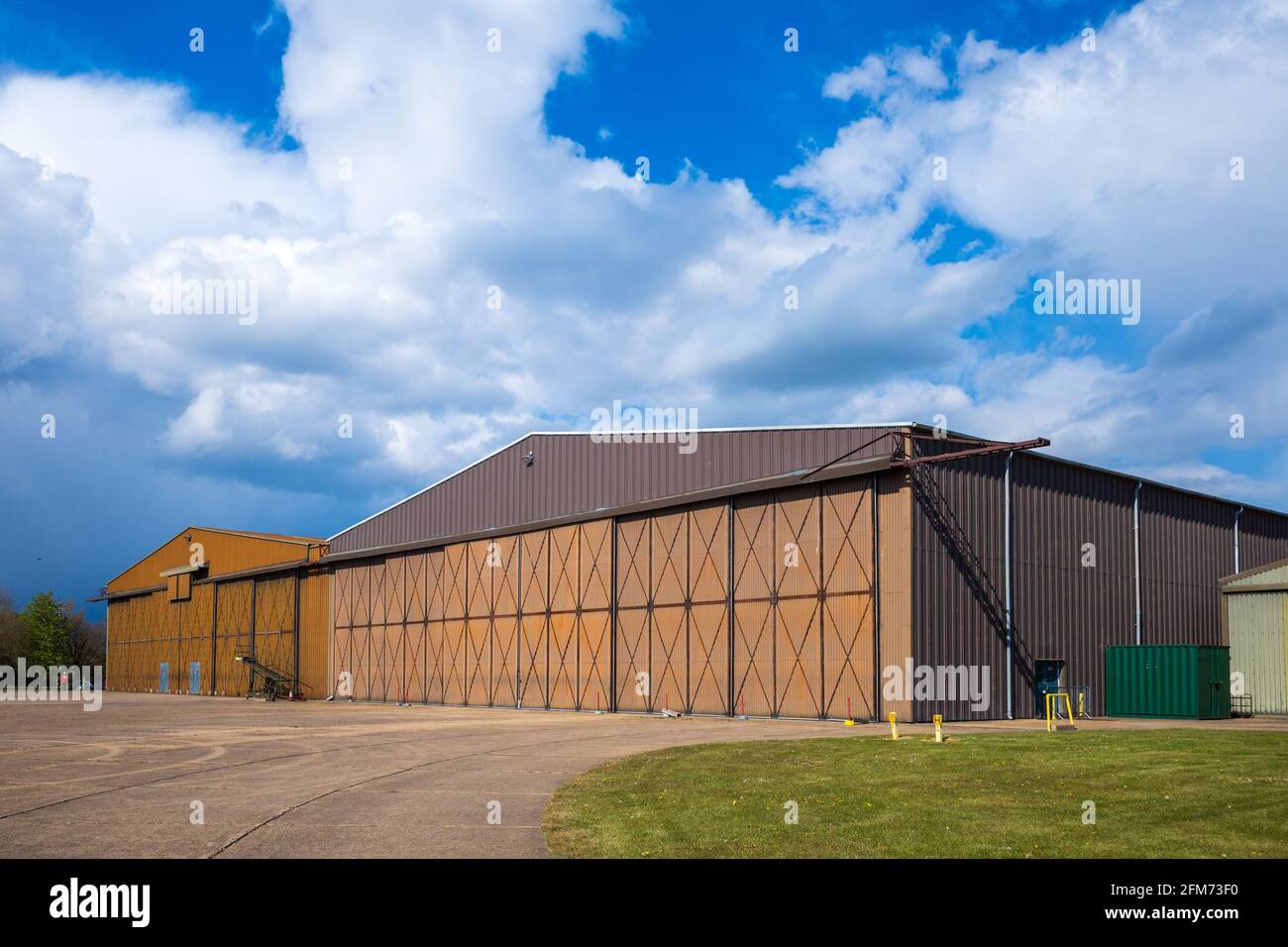 Duxford IWM Hangar 2 - Hangar 2 at the Imperial War Museum Duxford is  is a double Type T2 hangar, erected in the 1970s housing flying aircraft. Stock Photo