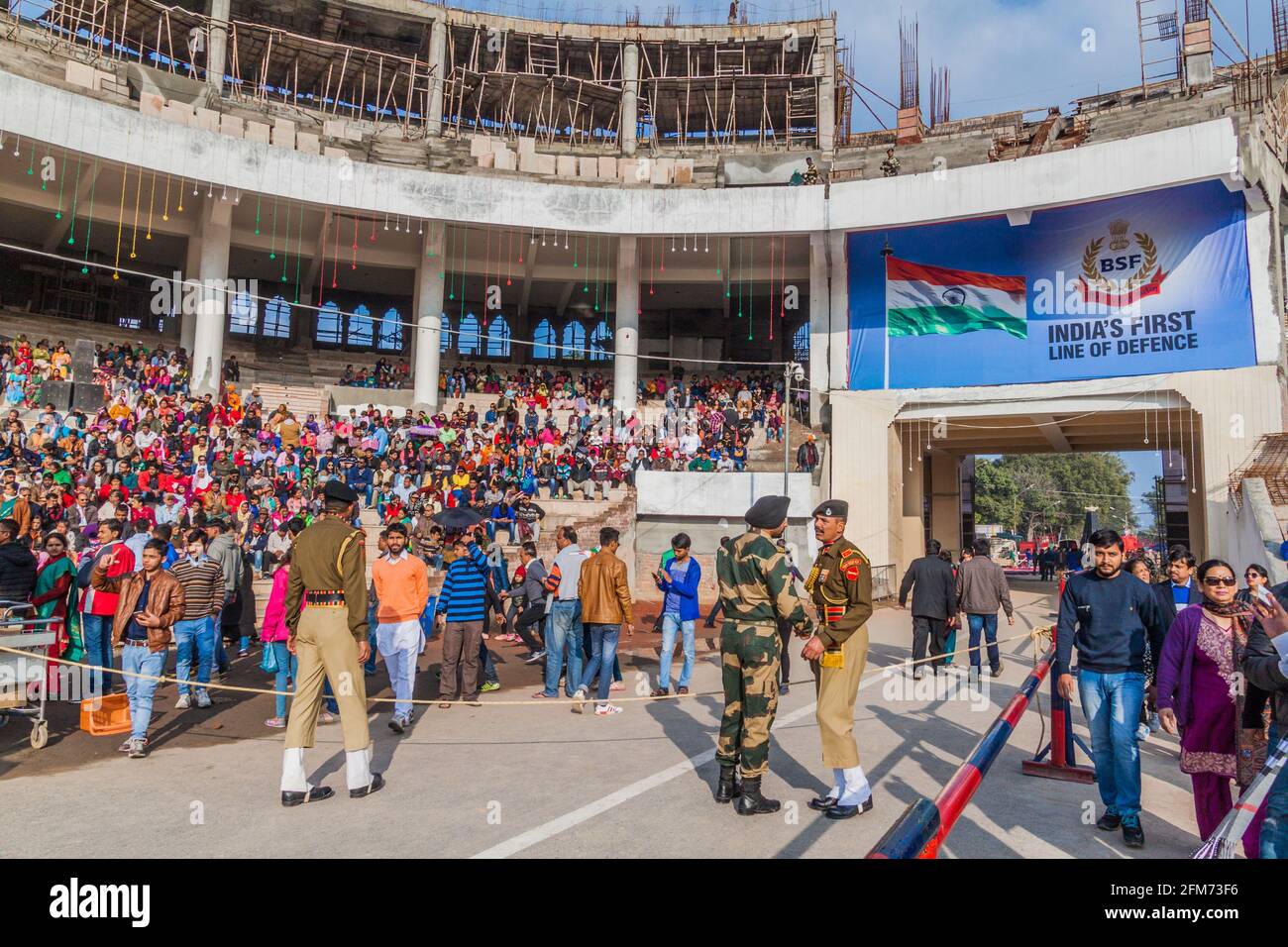 WAGAH, INDIA - JANUARY 26, 2017: People wait for the military ceremony at India-Pakistan border in Wagah in Punjab, India. Stock Photo
