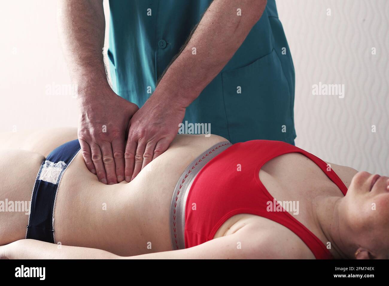 Belly massage. Anti-cellulite belly massage. Stock Photo