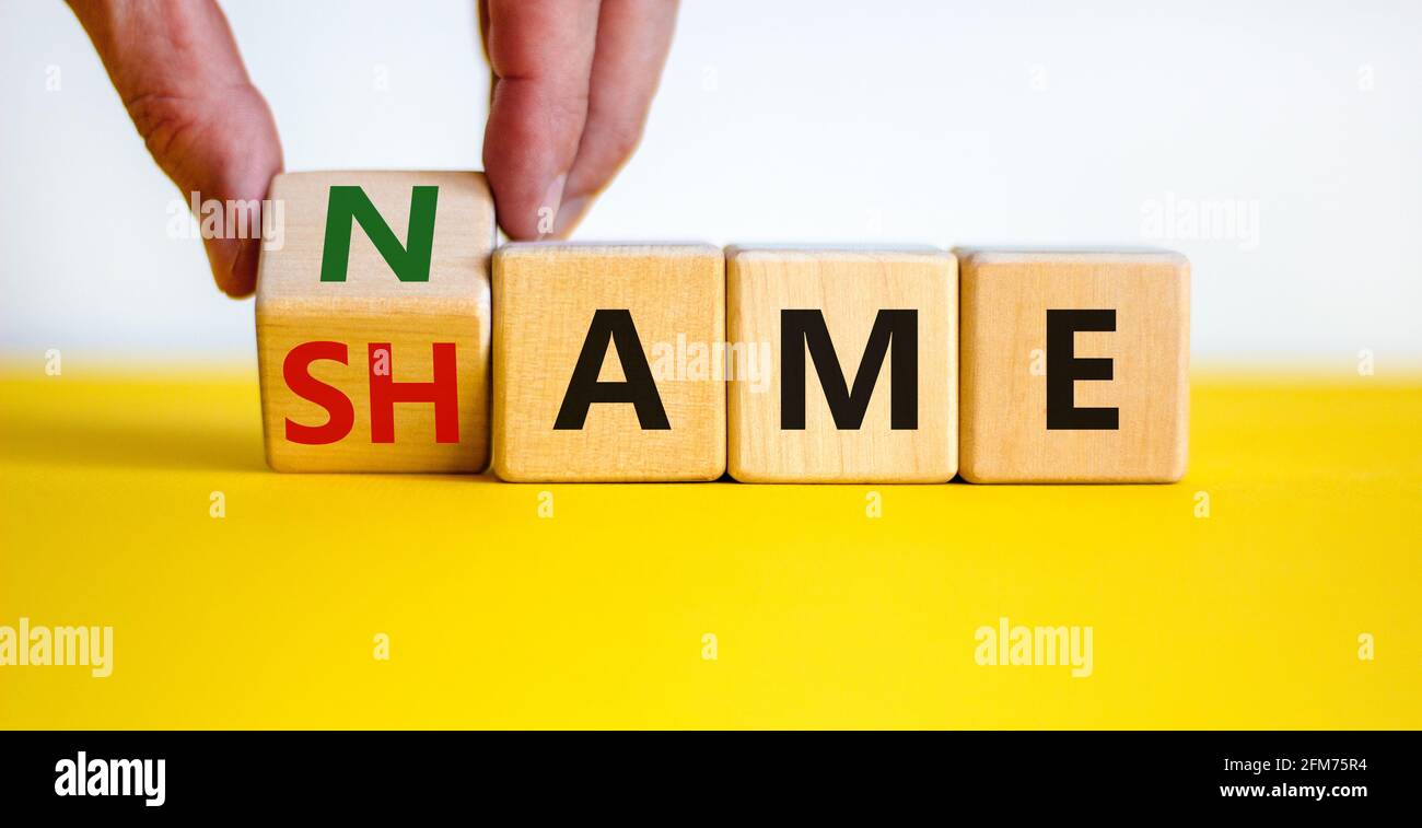 Name or shame symbol. Businessman turns the wooden cube and changes the