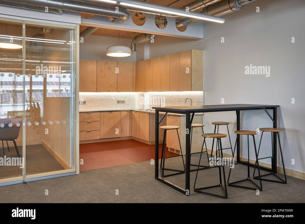 Office space interior with meeting room and kitchen. Storey Orsman Road, London, United Kingdom. Architect: Waugh Thistleton Architects, 2021. Stock Photo