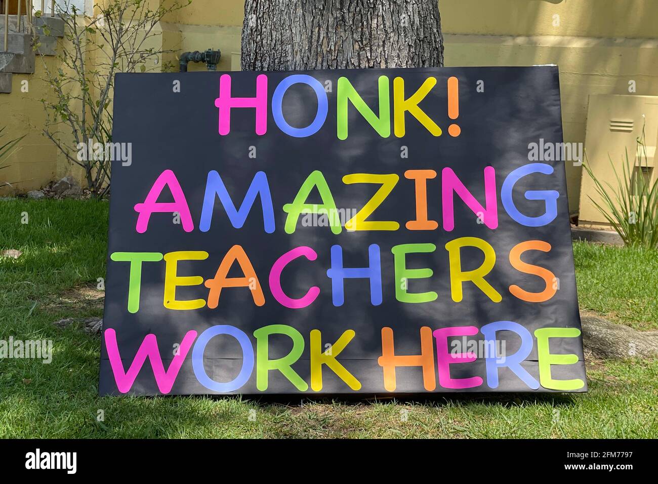 A "Honk! Amazing Teachers Work Here" sign in recognition of Teacher