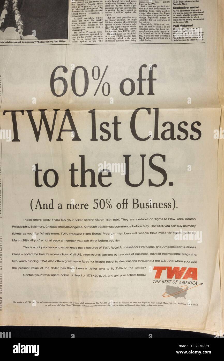 Advert for transatlantic First Class flights on TWA inside the Observer newspaper on 3rd March 1991 during the Iraq War. Stock Photo