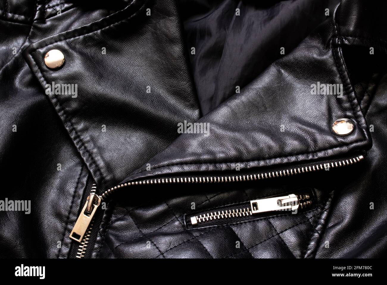 Black leather jacket with zip and stud close up Stock Photo