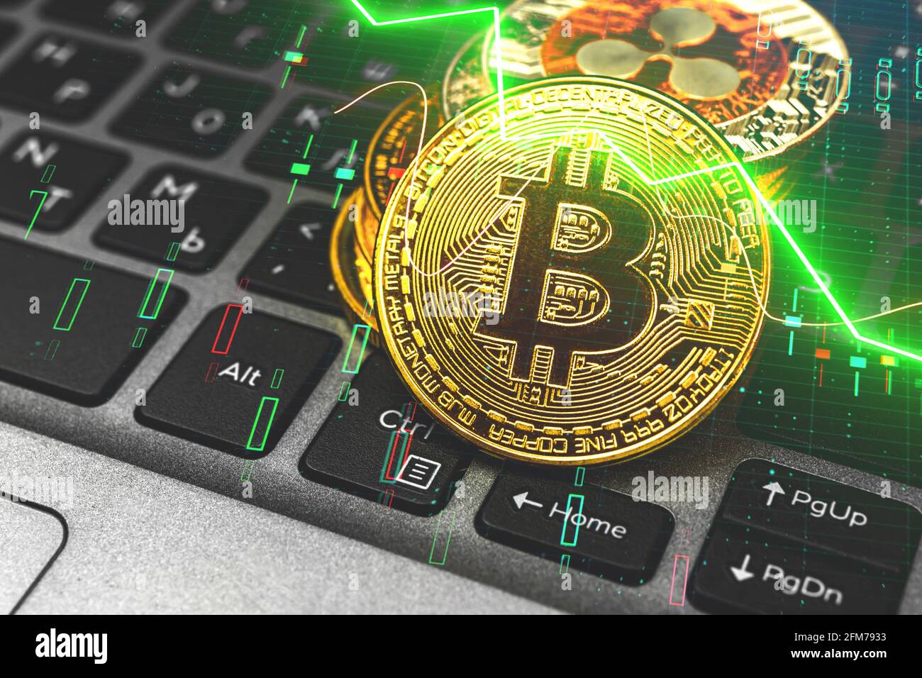 Golden bitcoin and stock charts background, golden crypto coins on laptop  keyboard with cryptography, stock market graphic Stock Photo - Alamy