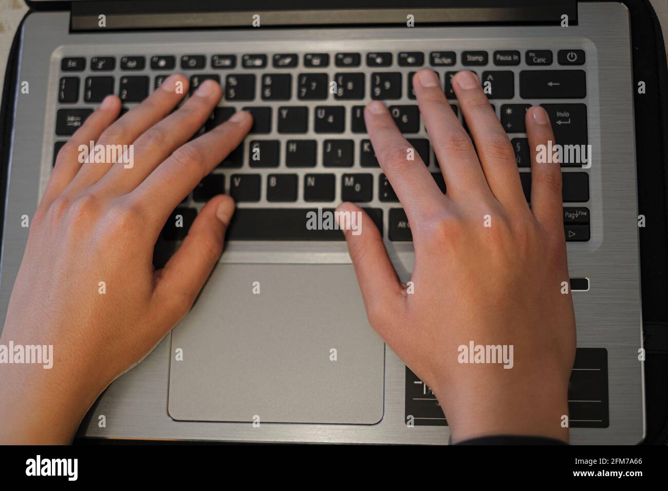 Top view of Woman hands view while using laptop for smart working,covid-19 pandemic  Stock Photo