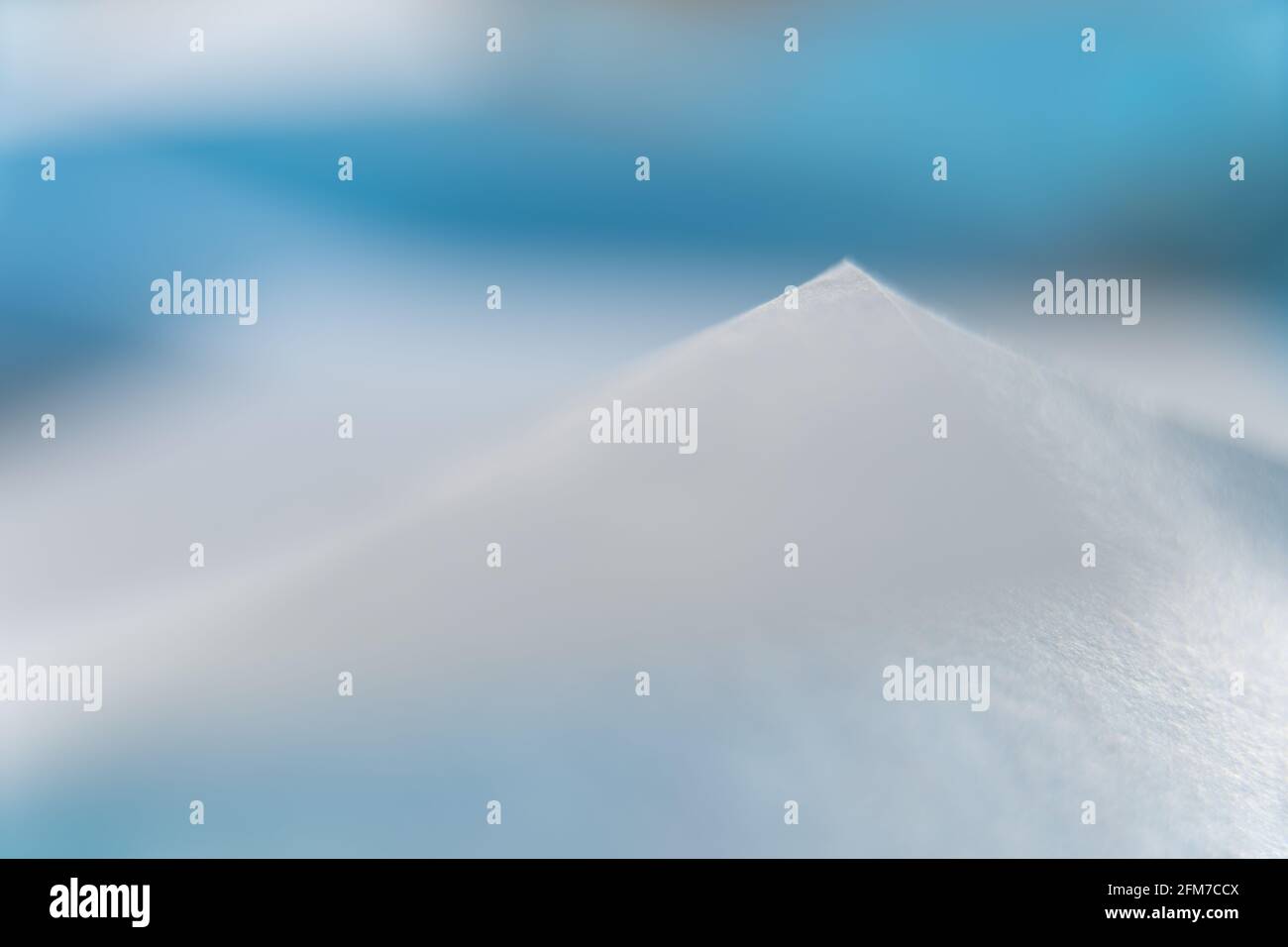 Abstract colored macro background, created with blue paper sheets. Curved lines and shapes and soft color. Stock Photo
