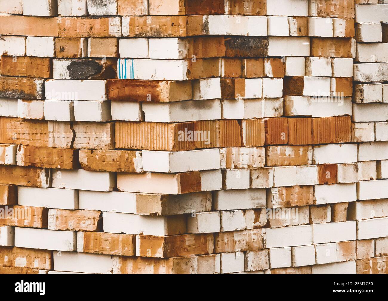 Heap of old white and brown bricks texture background Stock Photo - Alamy