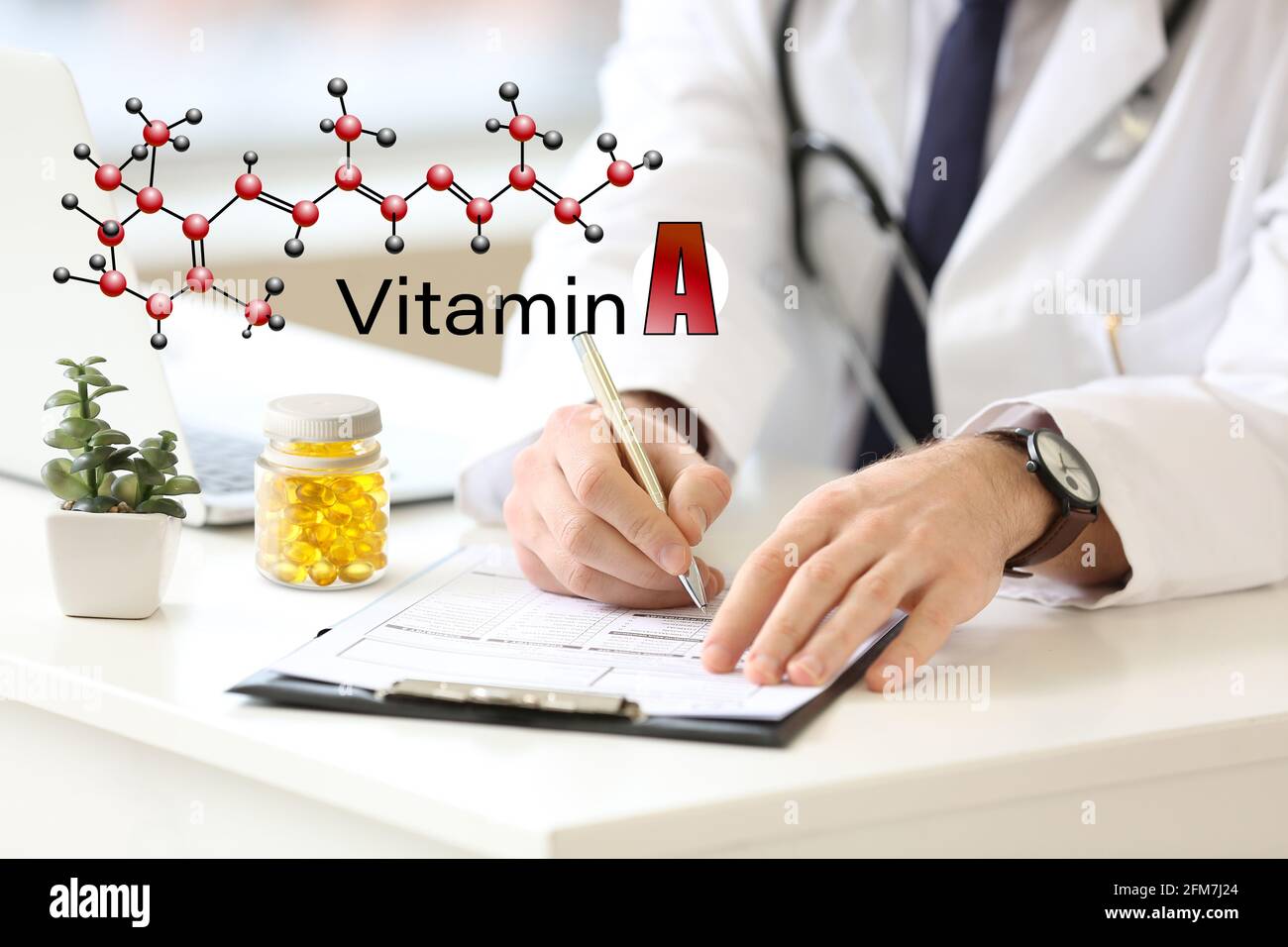 Doctor prescribing vitamin A in clinic Stock Photo