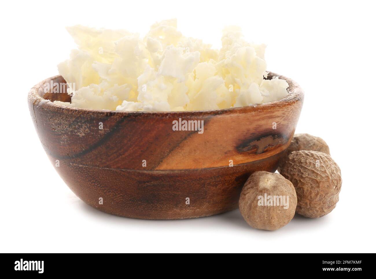 Bowl with shea butter and nuts on white background Stock Photo - Alamy