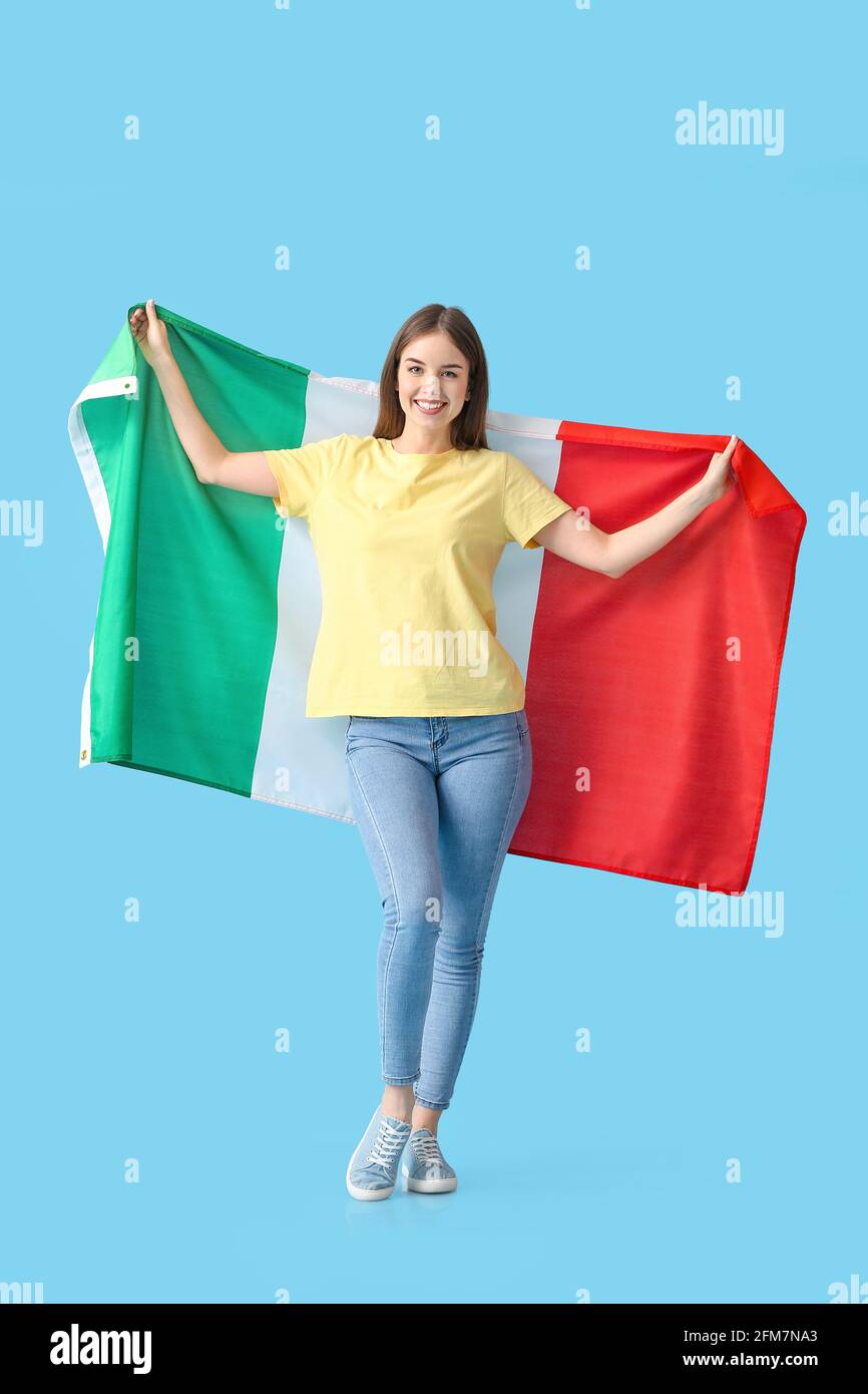 Beautiful young woman with Italian flag on color background Stock Photo