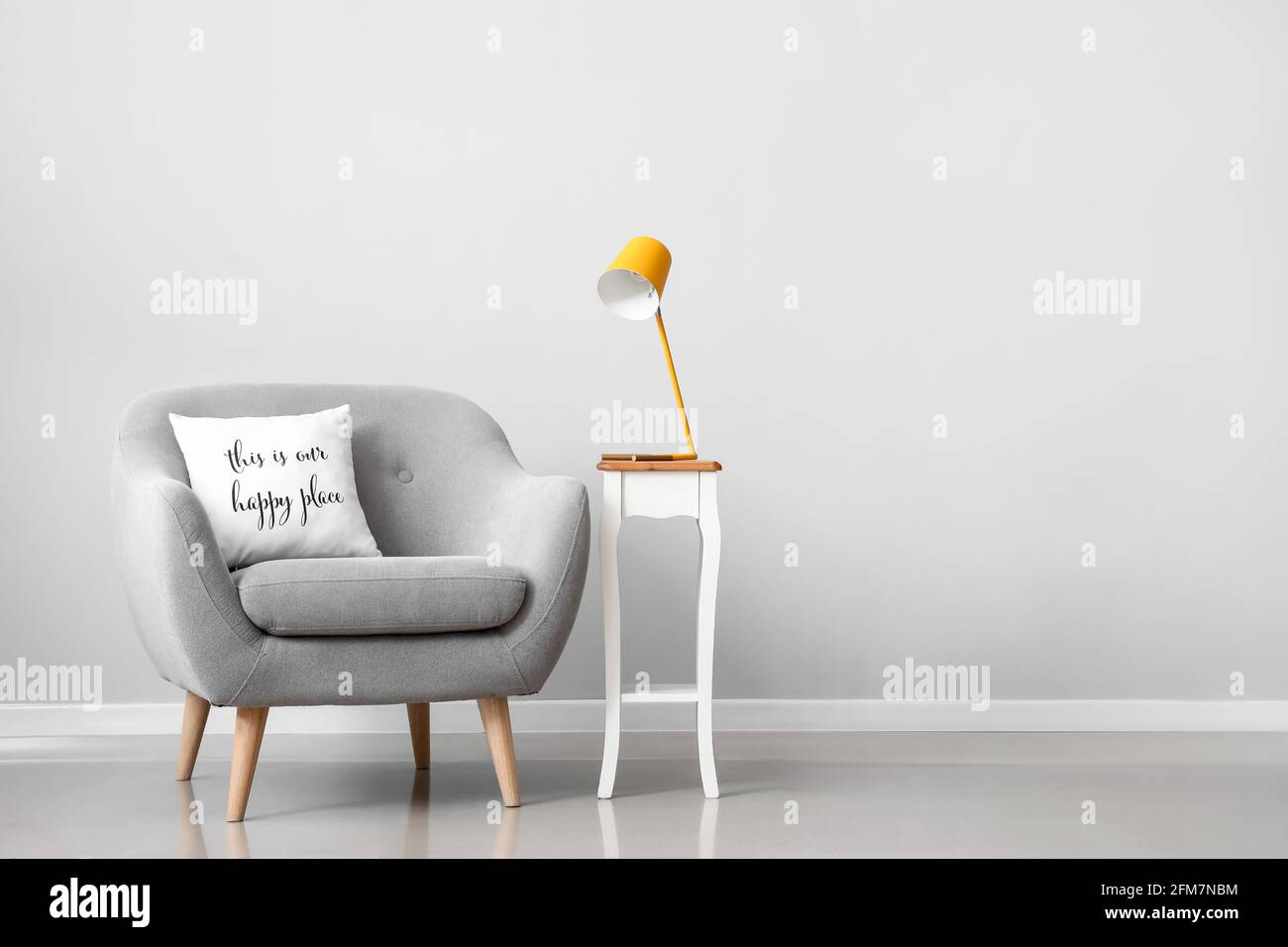 Interior of modern room with armchair and lamp Stock Photo - Alamy