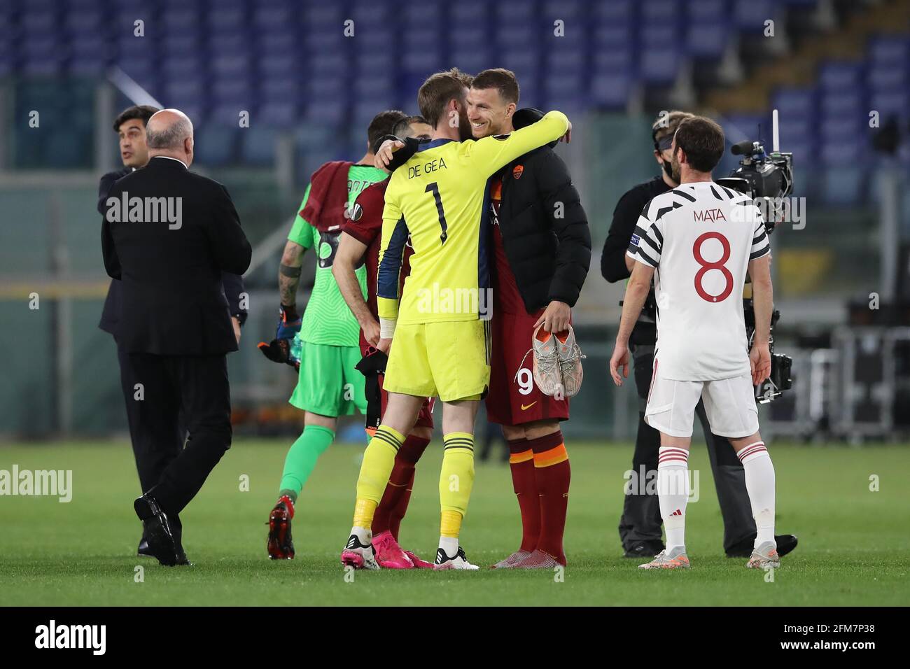 Rome, Italy, 6th May 2021. Juan Mata of Manchester United looks on as team  mate David De Gea embraces Edin Dzeko of AS Roma following the final  whistle of the UEFA Europa