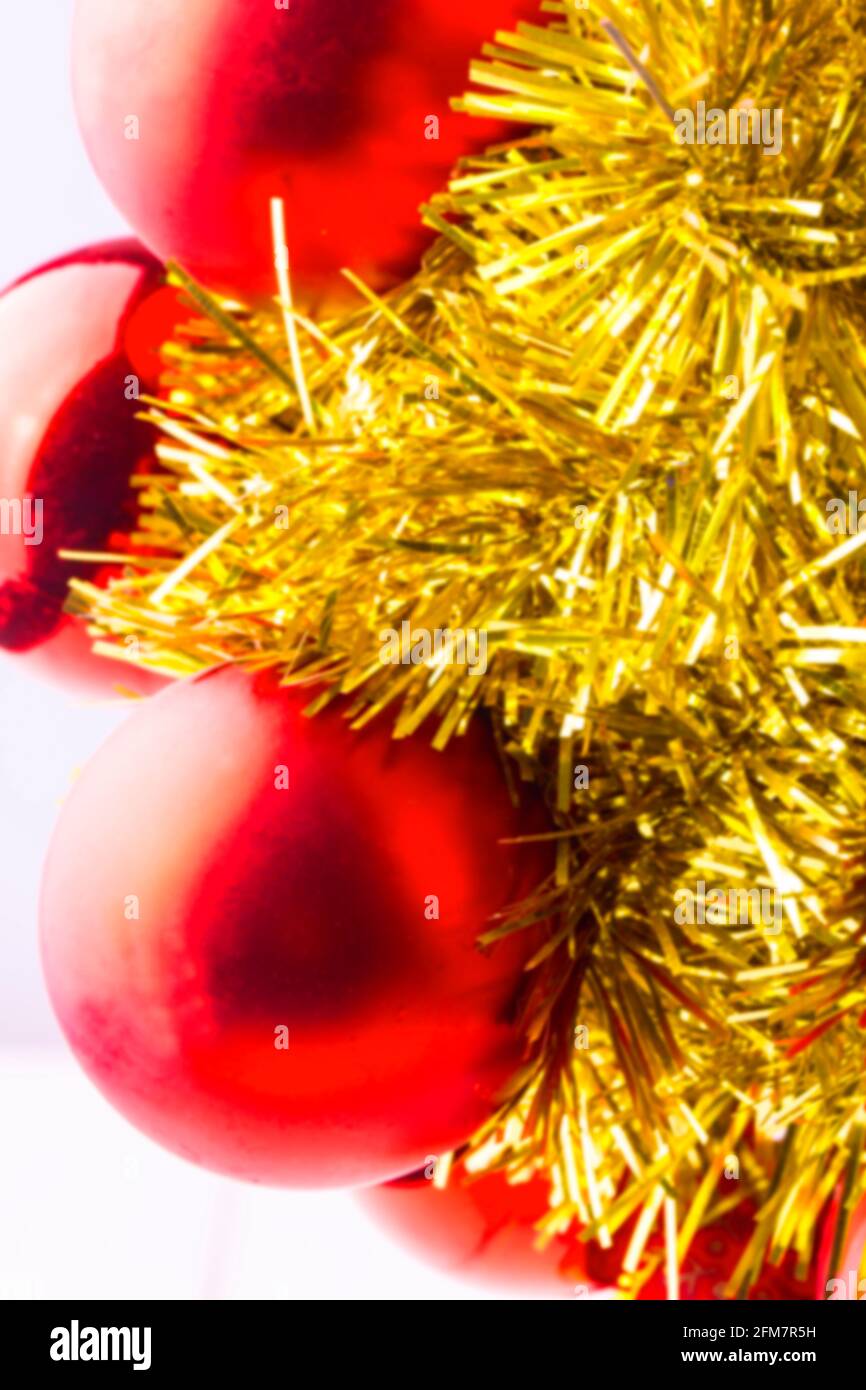 blurred background red Christmas balls and shiny ornaments on the white Stock Photo