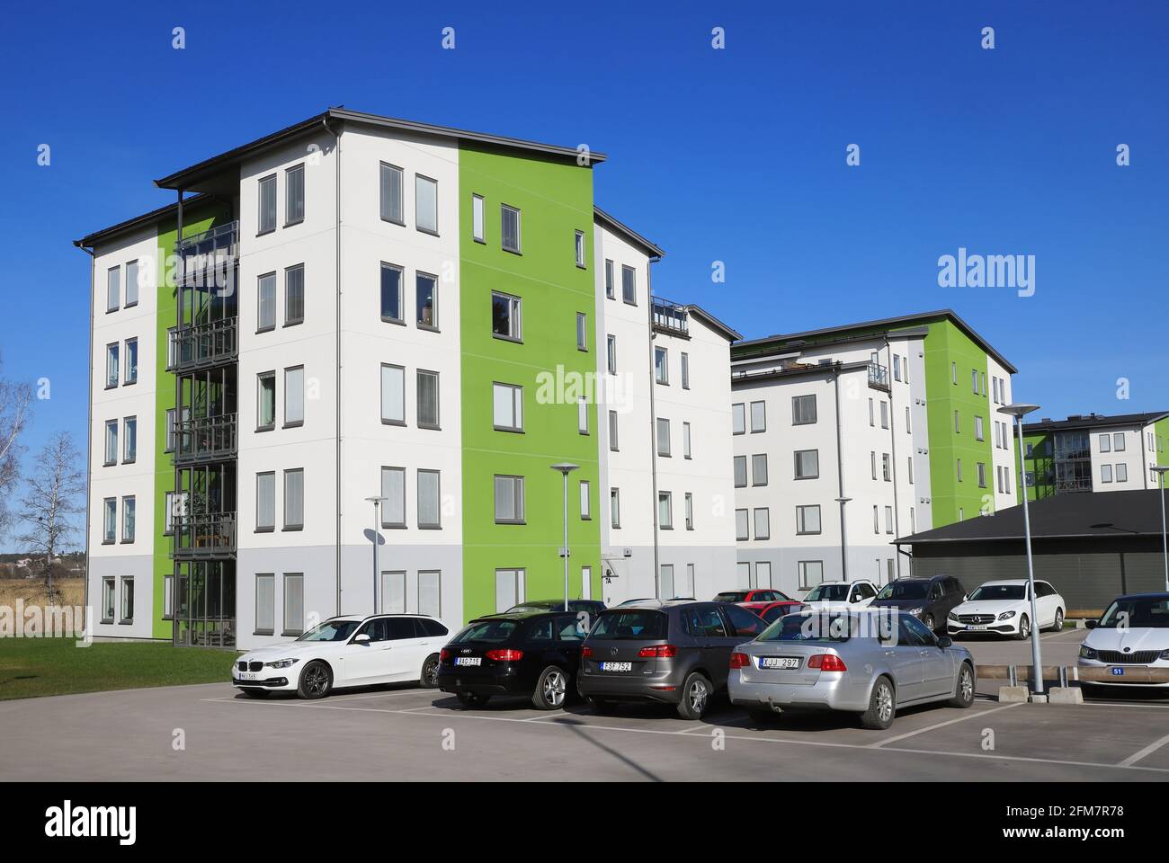 Nykoping, Sweden - April 18, 2021: Modern 2020s multi-family five floors apartment residential buildings located at the strandparksgatan street. Stock Photo