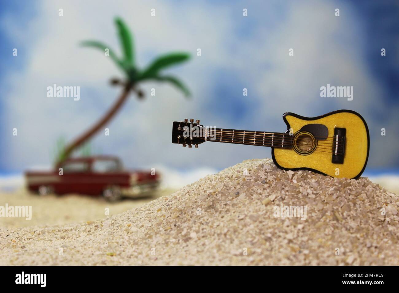 Guitar on Tropical Beach With Palm Trees in Background Stock Photo Alamy