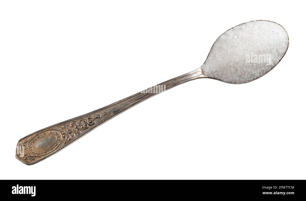 top view of refined white sugar from sugar beet in silver teaspoon cutout on white background Stock Photo