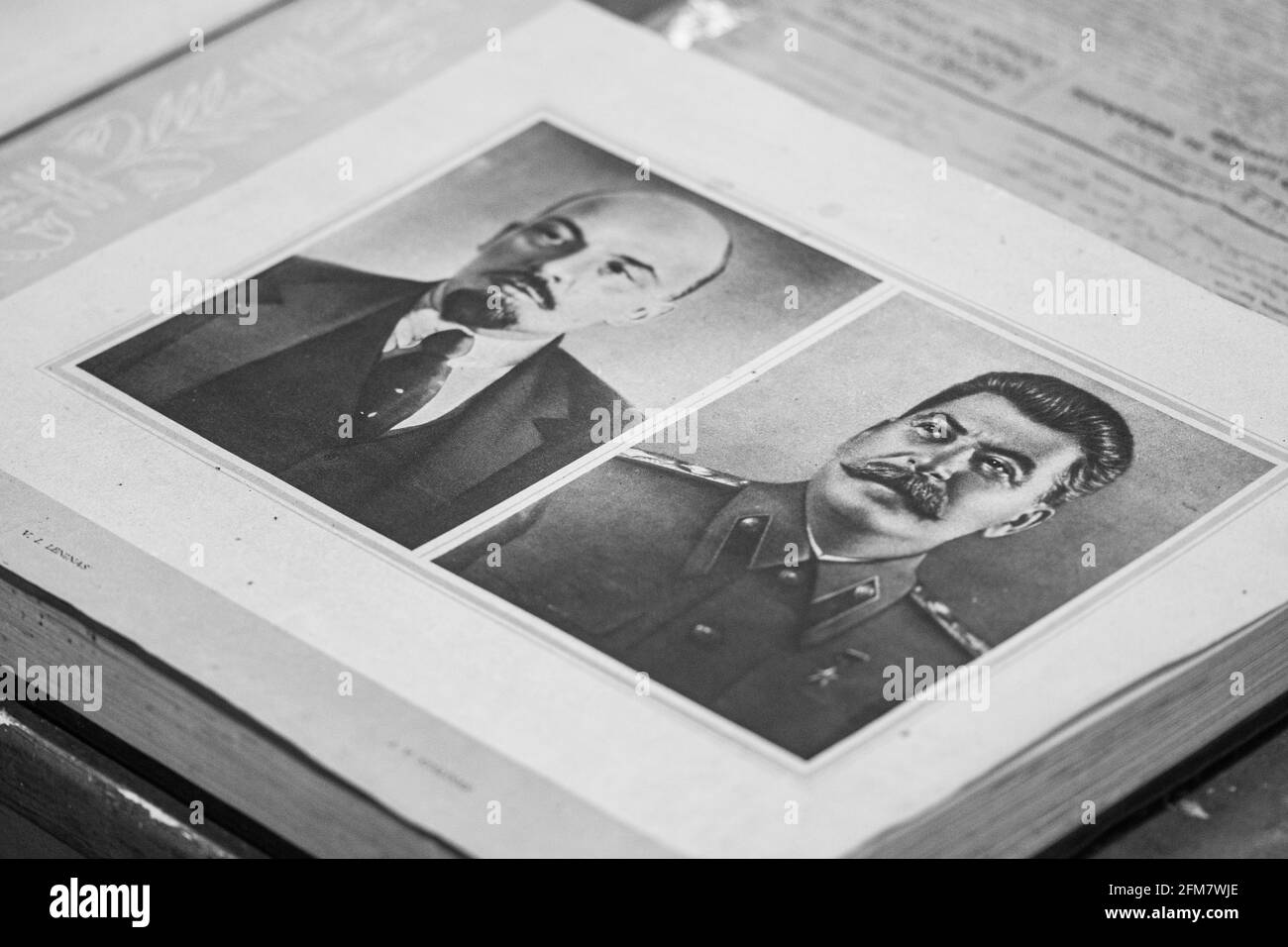 Old black and white photos of Stalin and Lenin in a book, on a desk, Soviet Union, Communism, Communist leaders Stock Photo