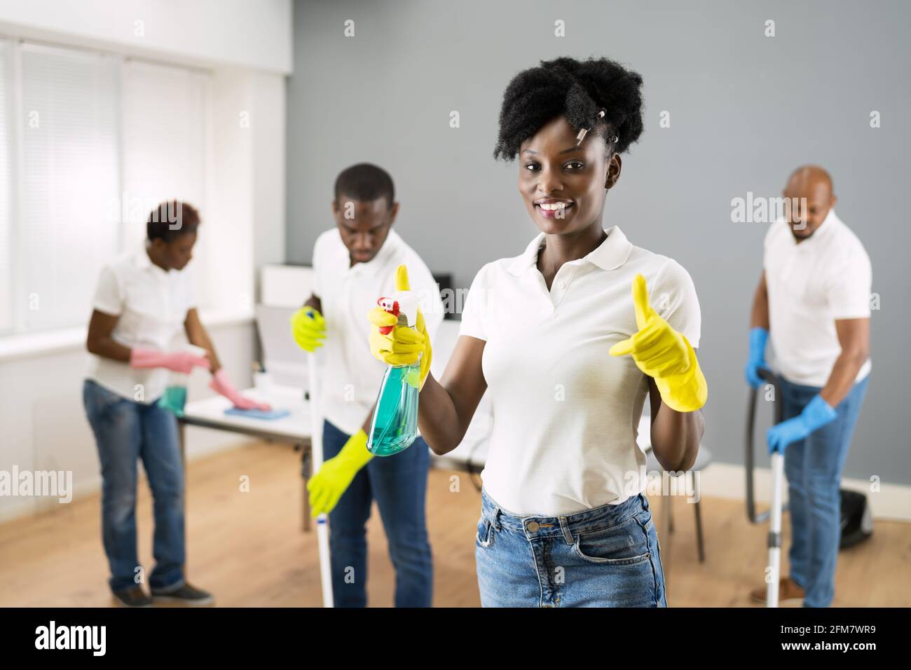 African Janitor Woman Cleaning Office. Commercial Services Stock Photo