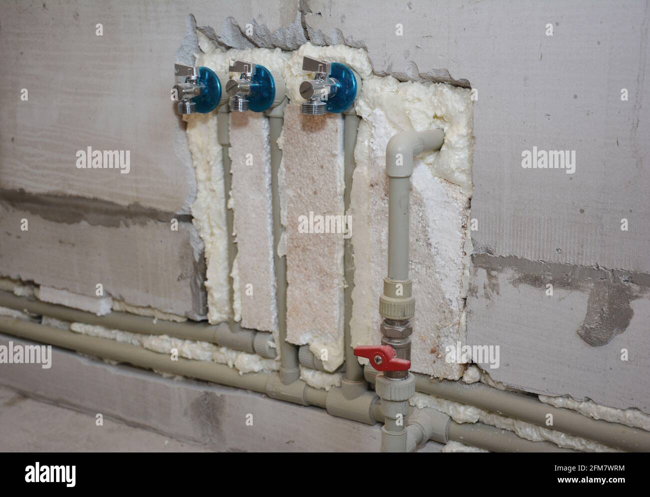 Bathroom renovation Hiding plumbing water pipes in cut concrete