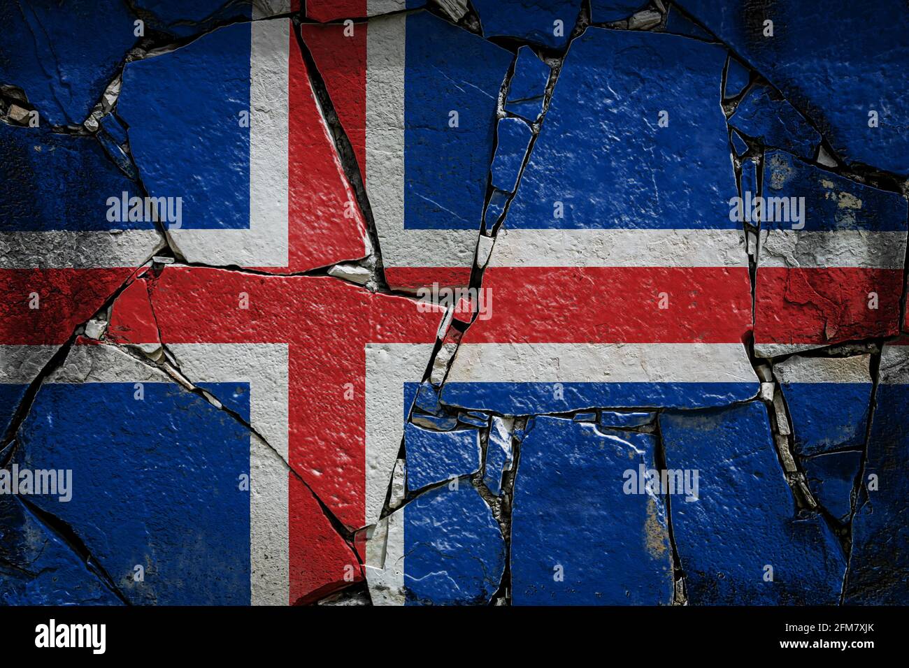 National flag of Iceland depicting in paint colors on an old stone wall ...