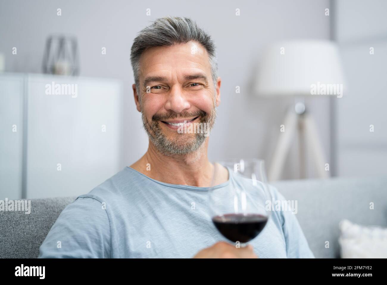 Man Drinking Red Wine In Video Conference At Home Stock Photo - Alamy