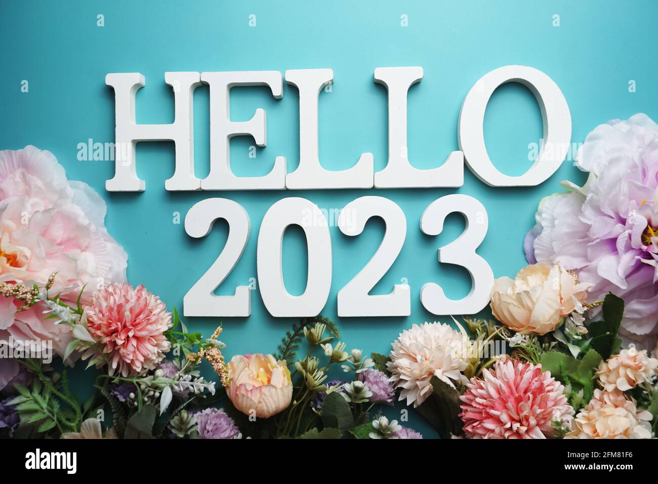 Hello 2023 Alphabet Letter With Flower Decoration On Blue Background   Hello 2023 Alphabet Letter With Flower Decoration On Blue Background 2FM81F6 