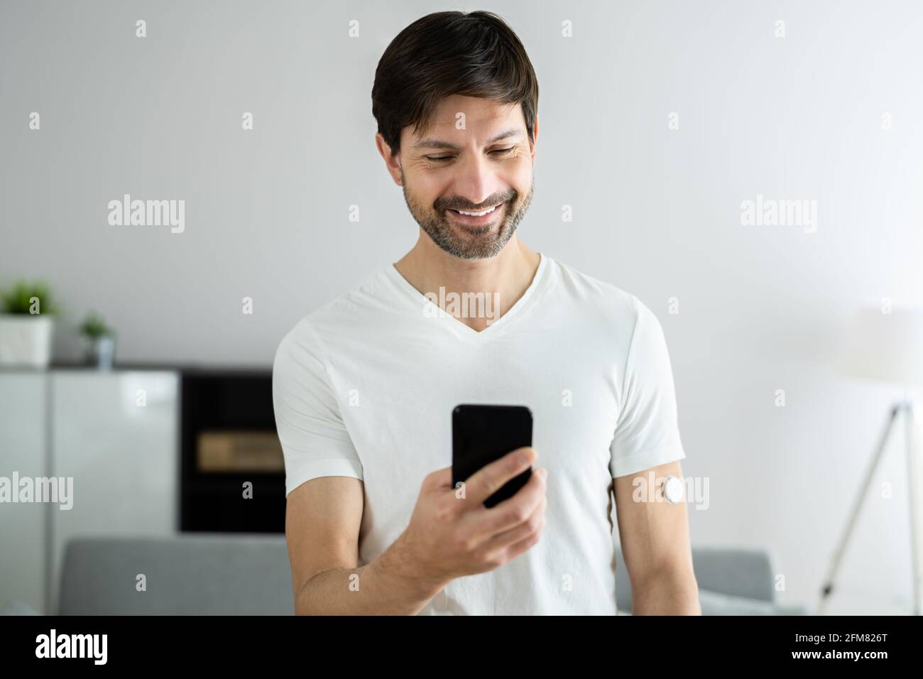 Continuous Glucose Monitor Blood Sugar Test Smart Phone App Stock Photo