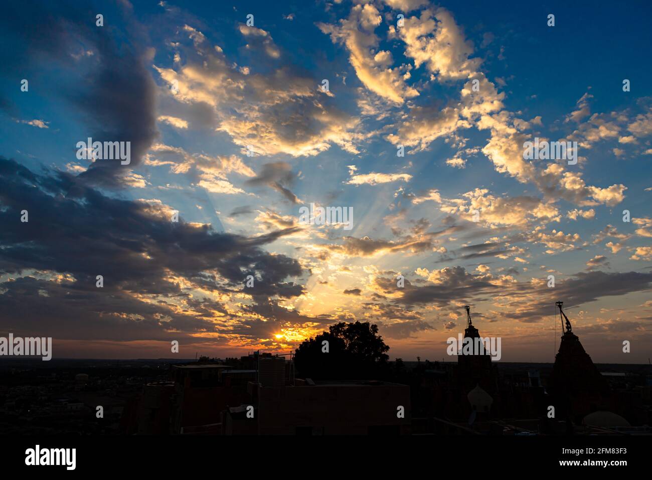 dramatic sky and beautiful sunset near jain temple jaisalmer,rajasthan. Stock Photo