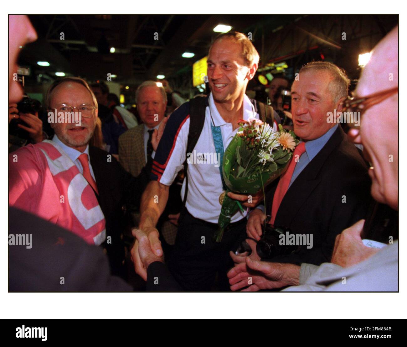 British Olympic Medalists arrive home at Heathrow airport....Steve Redgrave Coxless Four Rowing. Stock Photo