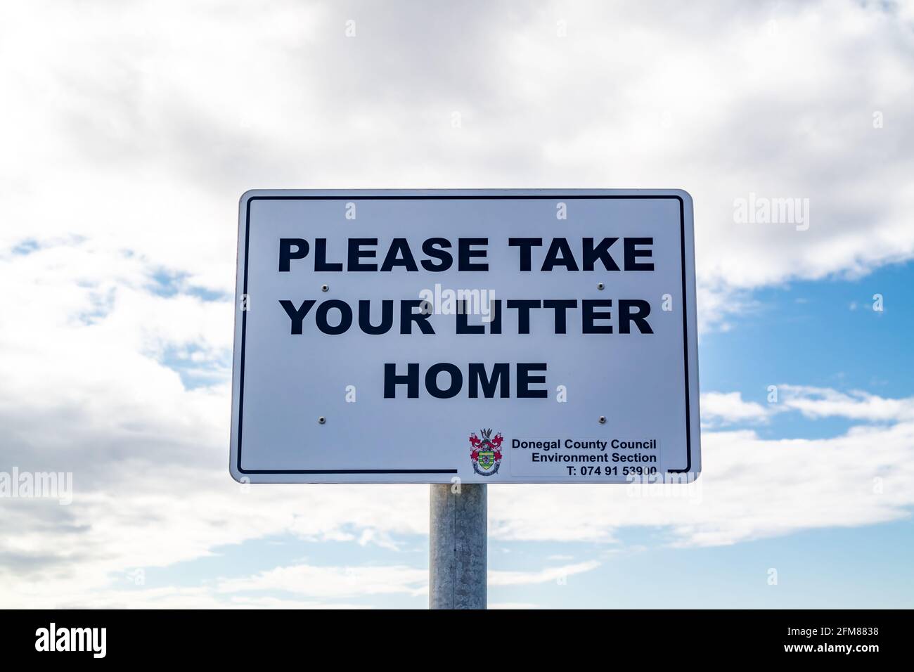 DONEGAL, IRELAND - APRIL 28 : Sign at the stairs down to the Silver Strand asking to take litter home. Stock Photo