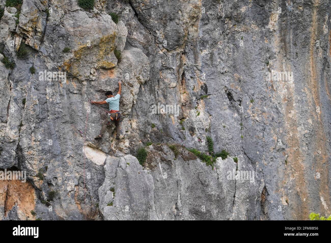 Rock Climbing, A man climbing a natural wall at Llano del Hondonero, Villanueva del Rosario, Andalucia, Southern Spain. Stock Photo