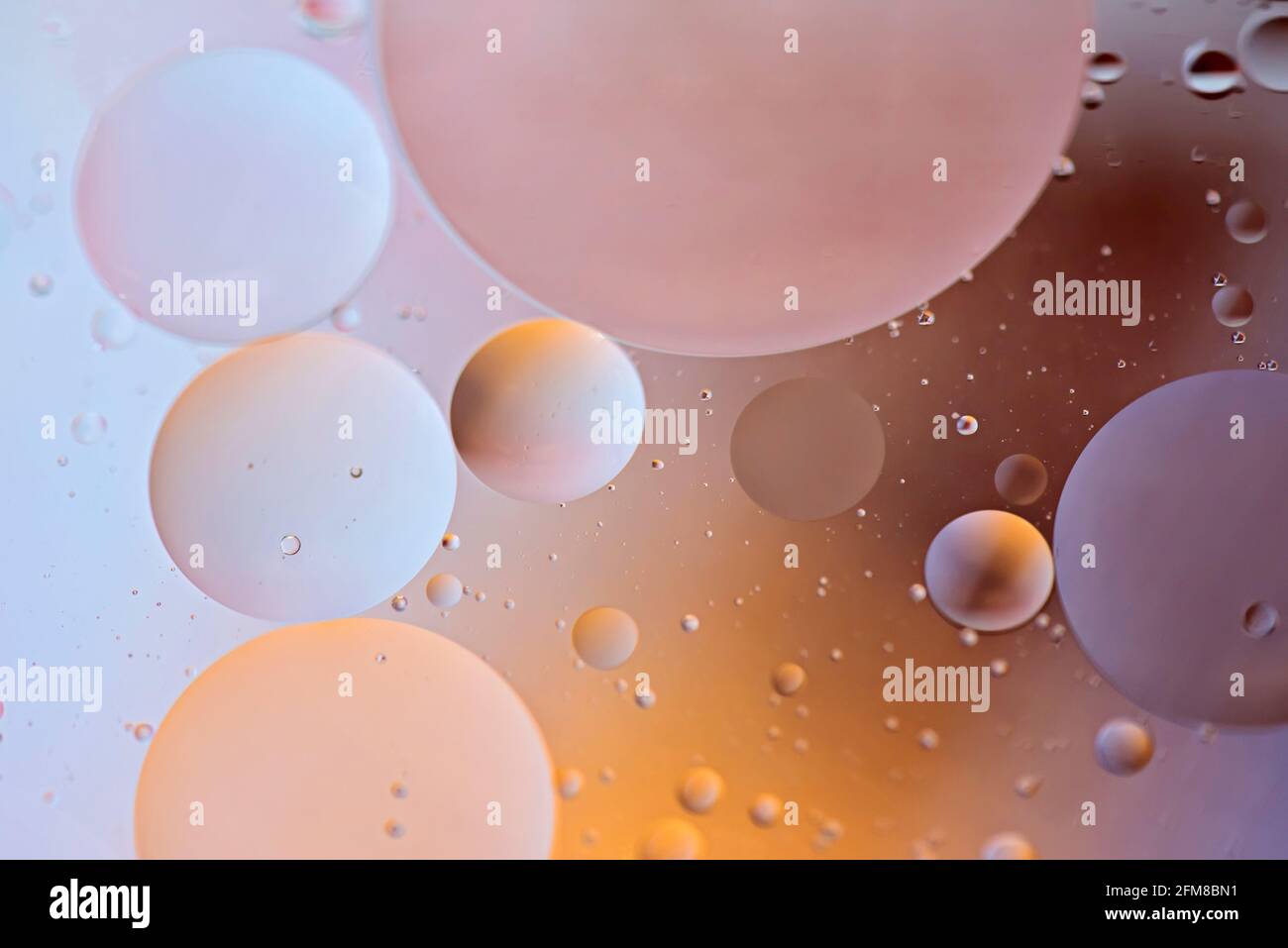 Colorful abstract background with oil drops on water Stock Photo