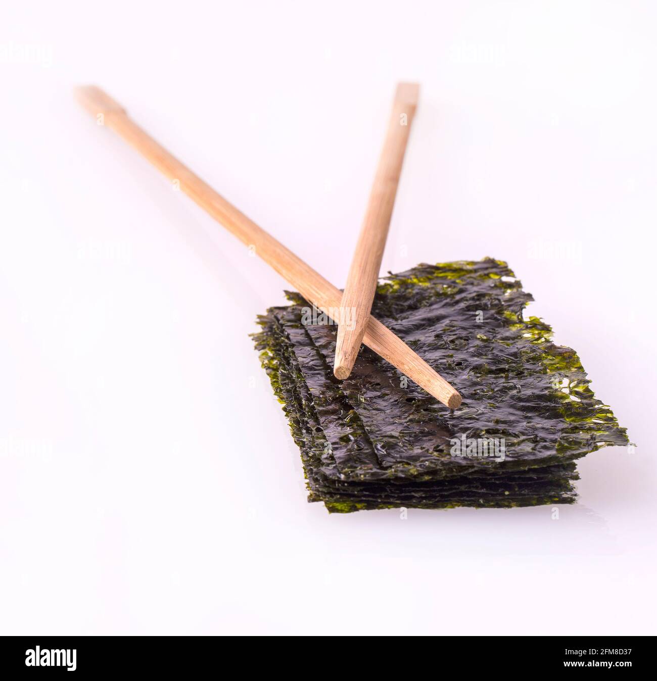 Nori sheets/Nori sheets with sticks on the white background Stock Photo