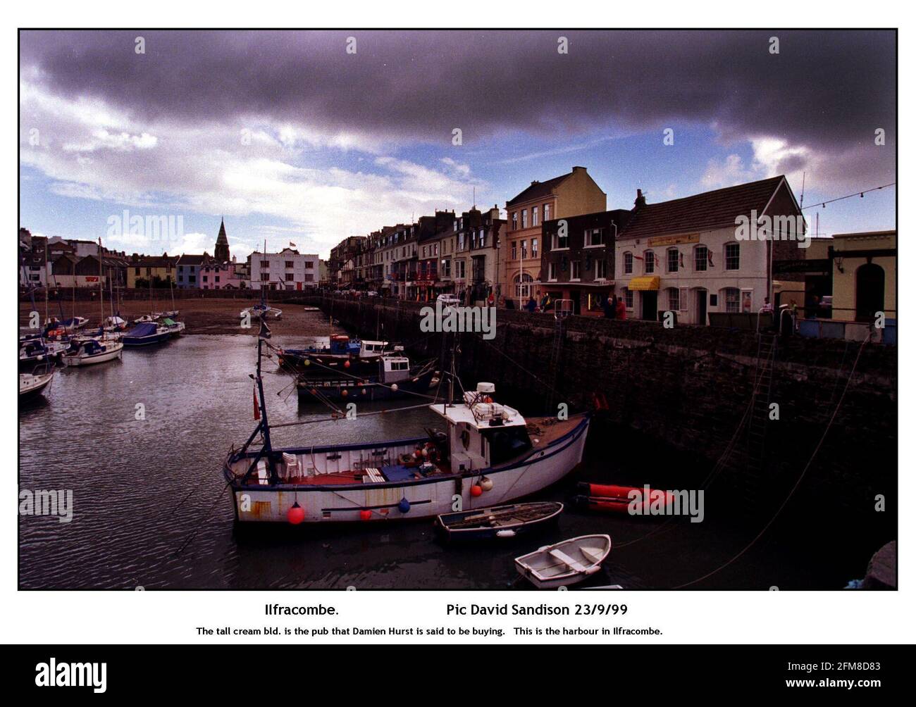 The tall cream bld. is the pub that Damien Hirst is said to be buying.   This is the harbour in Ilfracombe Stock Photo