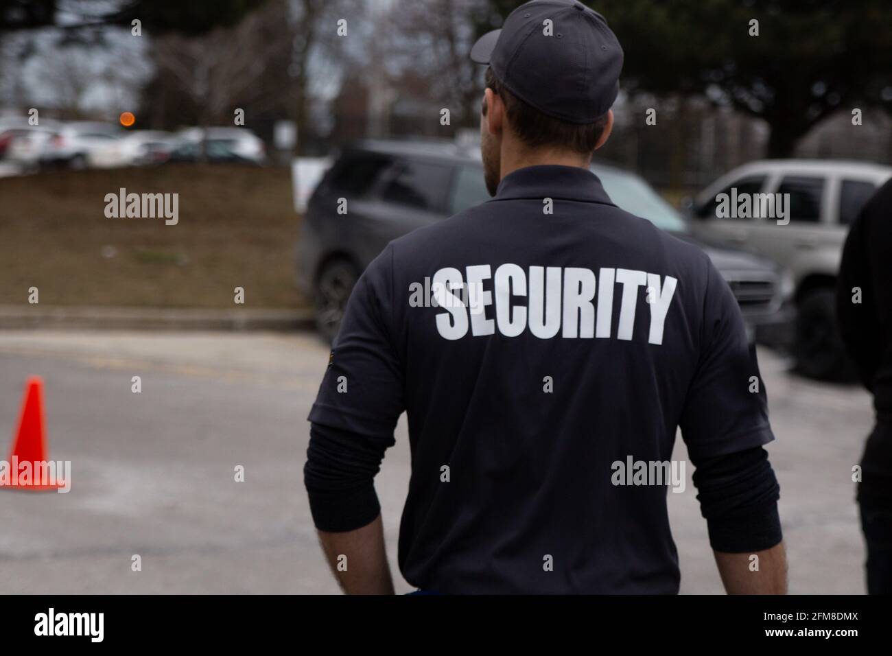 A rear view of parking security watching over parking area. Security ...